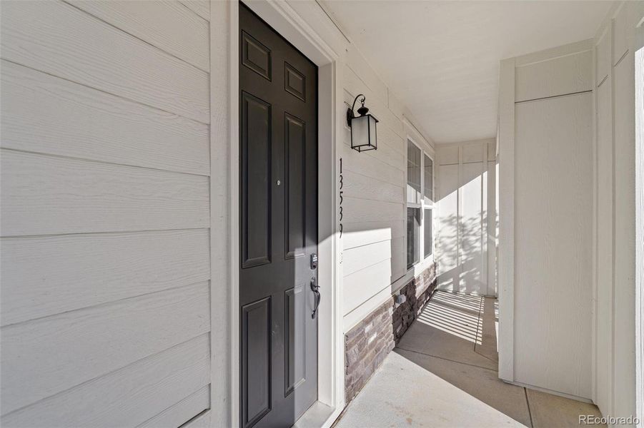 Exterior details and patio area of a home in Turnberry Villas, Commerce City (Image 4).