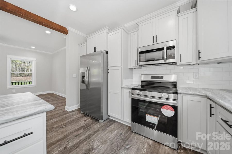 Furnished interior view inside a new home in , Lenoir (Image 3).
