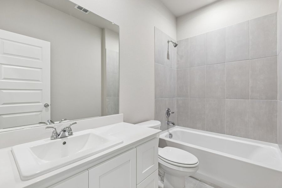 Bathroom in the Holden home plan by Trophy Signature Homes – REPRESENTATIVE PHOTO Bathroom in the Holden home plan by Trophy Signature Homes – REPRESENTATIVE PHOTO