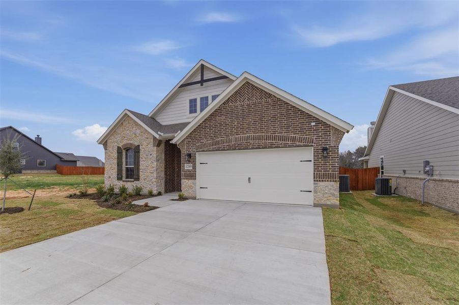 Front exterior of a new home in Covenant Park, Springtown, TX, highlighting curb appeal (Image 16).
