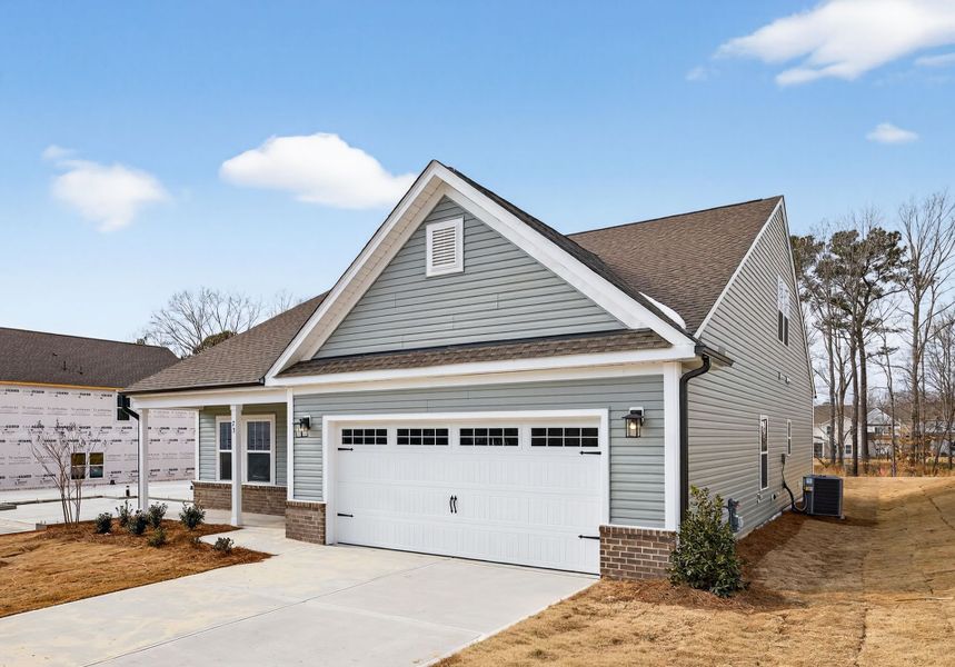 Front exterior of a new home in Copper Ridge at Flowers Plantation, Clayton, NC, highlighting curb appeal (Image 2).