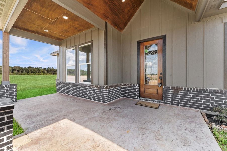 Covered Porch: Deep covered front porch with wood posts and brick accents—perfect for morning coffee and easy guest arrivals. Covered Porch: Deep covered front porch with wood posts and brick accents—perfect for morning coffee and easy guest arrivals.