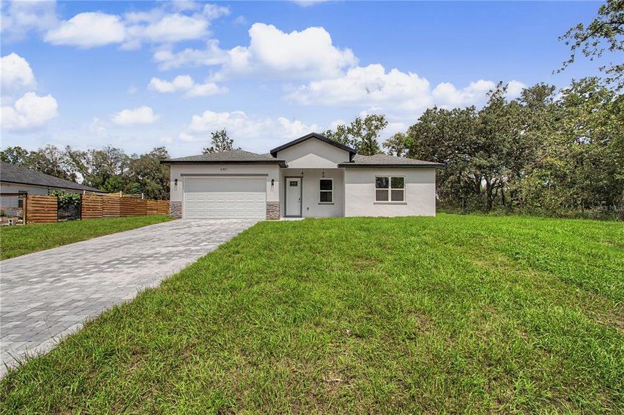 Front exterior of a new home in , Ocala, FL, highlighting curb appeal (Image 27).