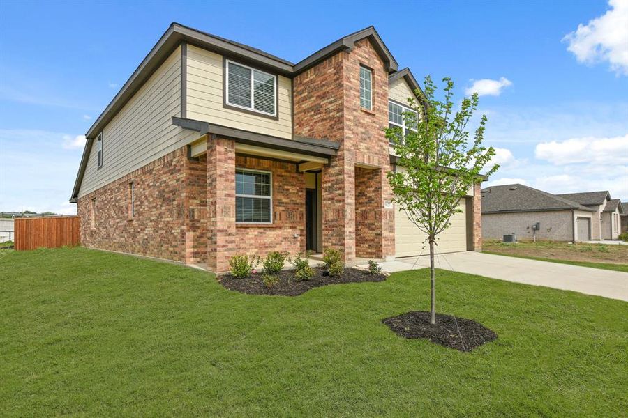 Front exterior of a new home in Burgess Meadows, Cleburne, TX, highlighting curb appeal (Image 13). Front exterior of a new home in Burgess Meadows, Cleburne, TX, highlighting curb appeal (Image 13).