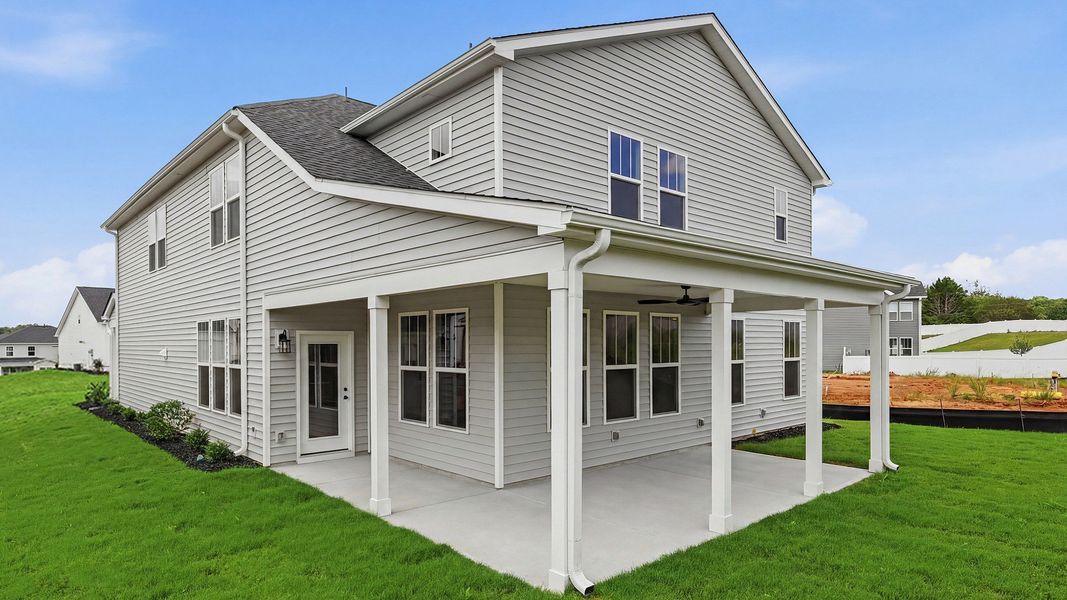 Notable exterior includes a rear covered porch designed for year-round enjoyment at the Woodglen community Notable exterior includes a rear covered porch designed for year-round enjoyment at the Woodglen community