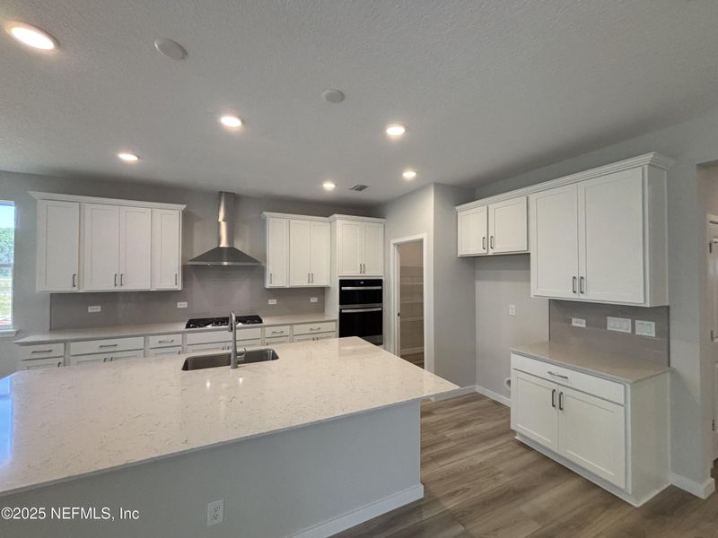 Furnished interior view inside a new home in The Cypress Series at Reserve East, Flagler Beach (Image 5).