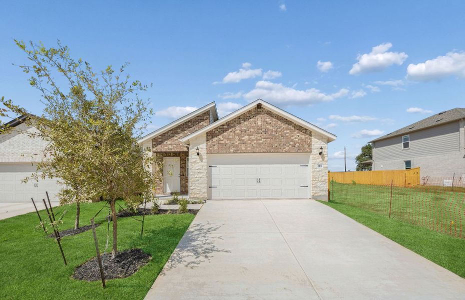 Front exterior of a new home in Crosswinds, Kyle, TX, highlighting curb appeal (Image 19).