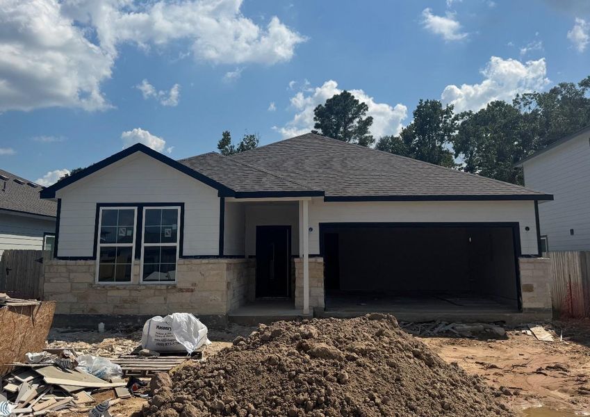 Exterior details and patio area of a home in Liberty Collection at Granger Pines, Conroe (Image 2).