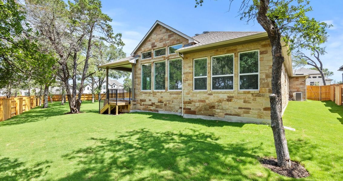 Front exterior of a new home in 6 Creeks, Kyle, TX, highlighting curb appeal (Image 20). Front exterior of a new home in 6 Creeks, Kyle, TX, highlighting curb appeal (Image 20).