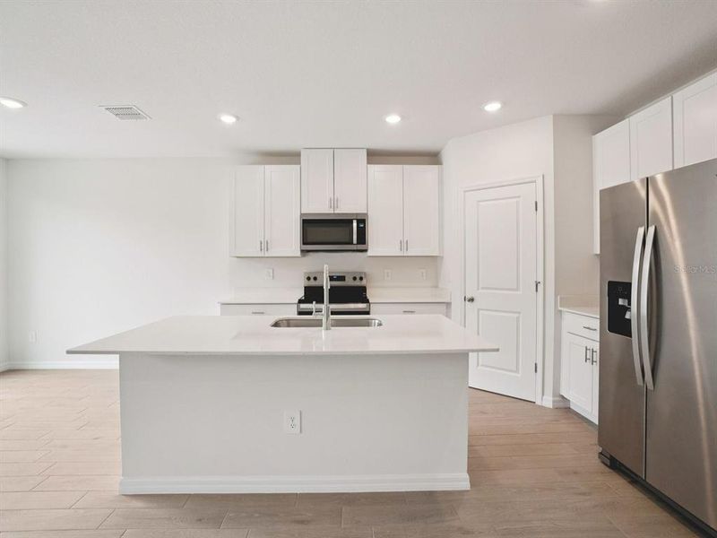 Furnished interior view inside a new home in The Grove at Stuart Crossing - Classic Series, Bartow (Image 3). Furnished interior view inside a new home in The Grove at Stuart Crossing - Classic Series, Bartow (Image 3).