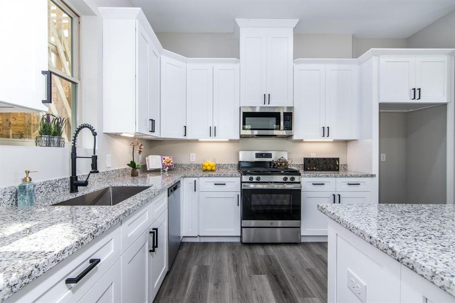 All stainless steel appliances, and easy to care for vinyl plank flooring.