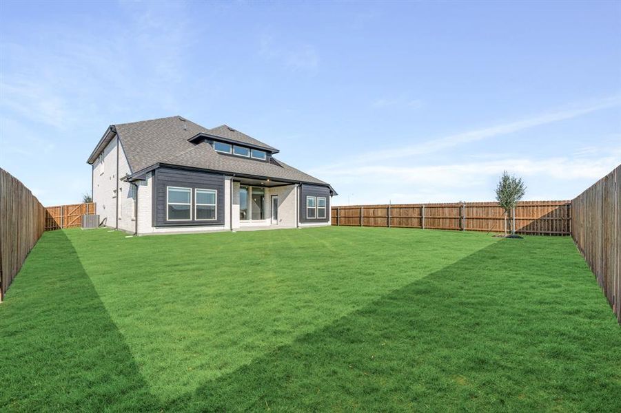 Front exterior of a new home in Wildflower Ranch 60-65, Fort Worth, TX, highlighting curb appeal (Image 2). Front exterior of a new home in Wildflower Ranch 60-65, Fort Worth, TX, highlighting curb appeal (Image 2).