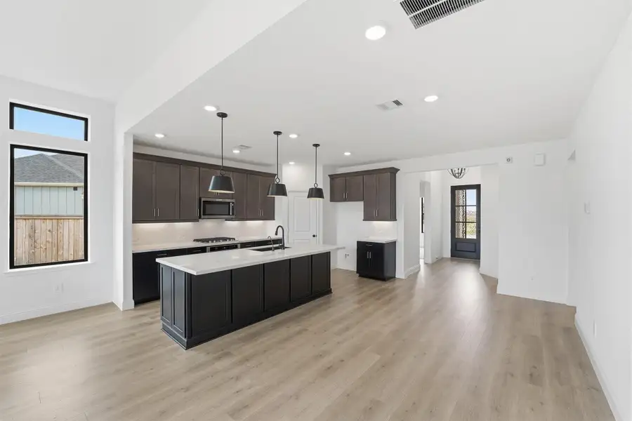 Furnished interior view inside a new home in Bridgeland, Cypress (Image 5).