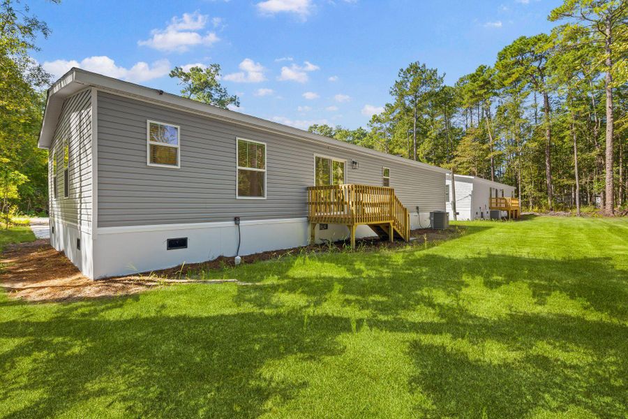 Exterior details and patio area of a home in , Ravenel (Image 26).