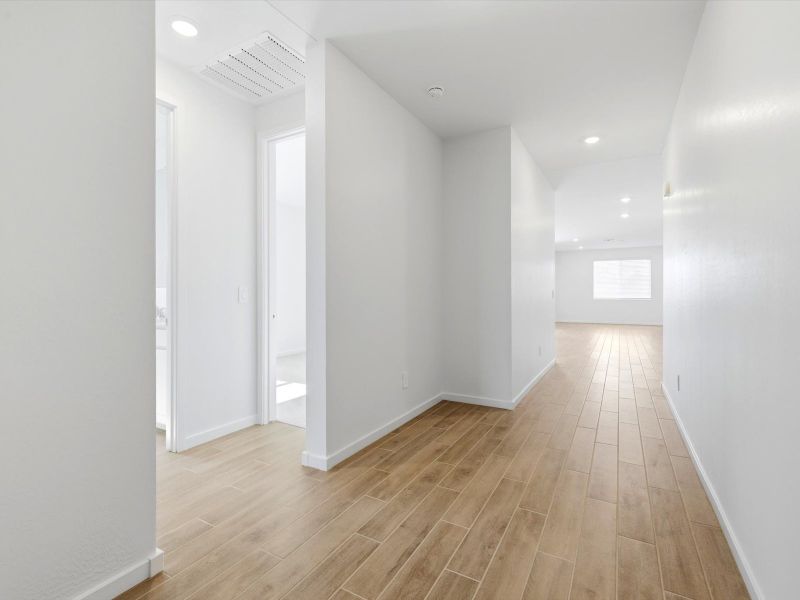 Spacious, unfurnished interior of a new home in Blossom Rock Reserve Series, Apache Junction (Image 12).