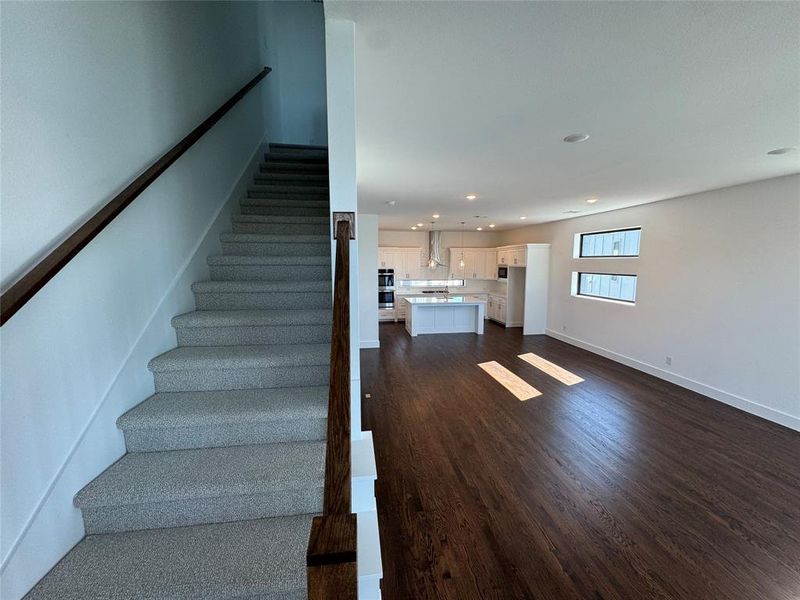 Stairs featuring wood-type flooring