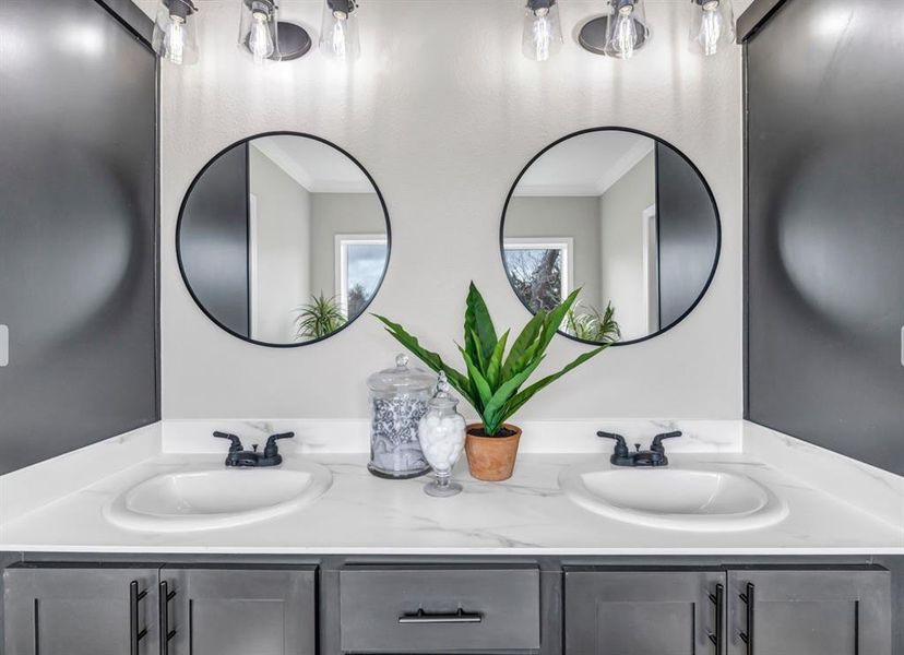 Bathroom featuring double vanity