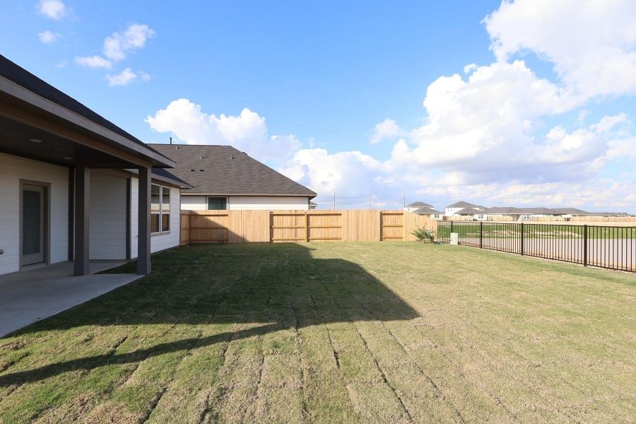 Exterior details and patio area of a home in The Timbers at Mason Woods, Cypress (Image 4).