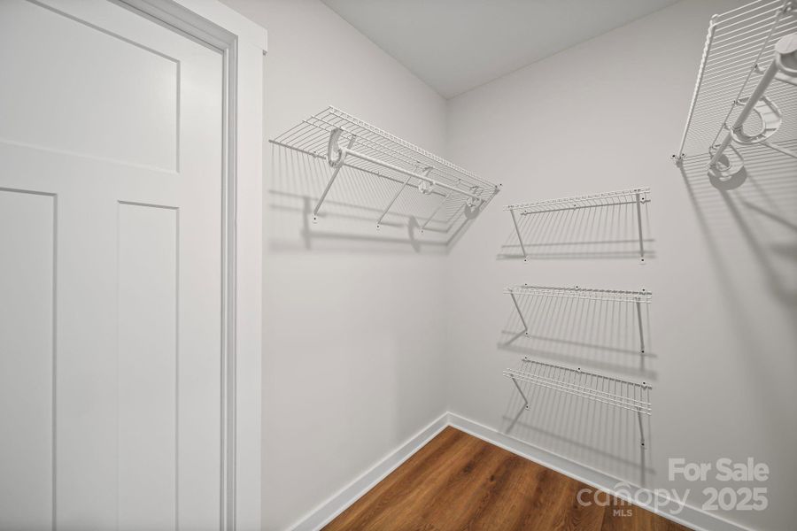 Primary closet w/ solid wire rack shelving. Primary closet w/ solid wire rack shelving.