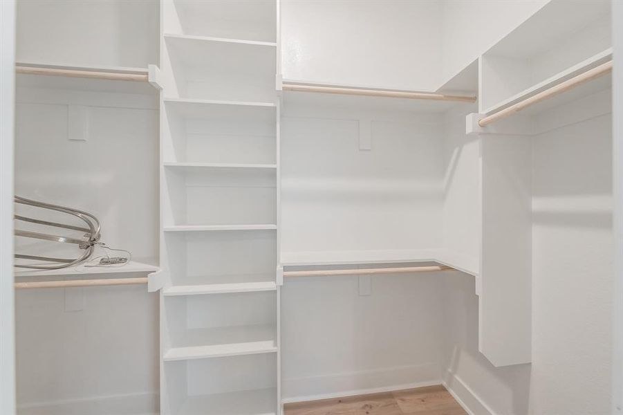 Walk in closet featuring light wood-type flooring