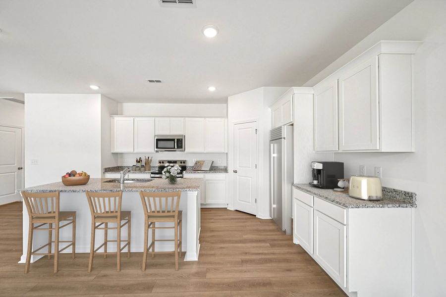 Representative furnished interior of a home built from the Meadow by Ashton Woods in Middleton Farms, Middlesex (Image 5).