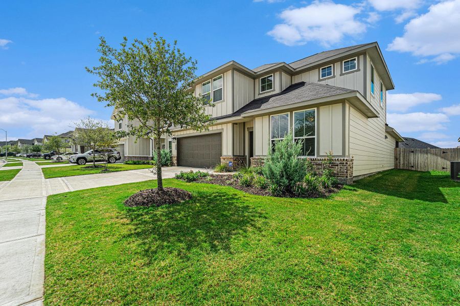 Front exterior of a new home in The Timbers at Mason Woods, Cypress, TX, highlighting curb appeal (Image 26). Front exterior of a new home in The Timbers at Mason Woods, Cypress, TX, highlighting curb appeal (Image 26).