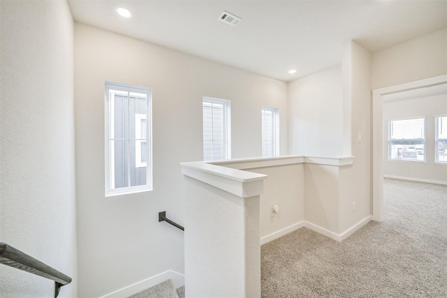 At the top of the 2nd floor stairs is this useful nook that could house a desk / office area. At the top of the 2nd floor stairs is this useful nook that could house a desk / office area.