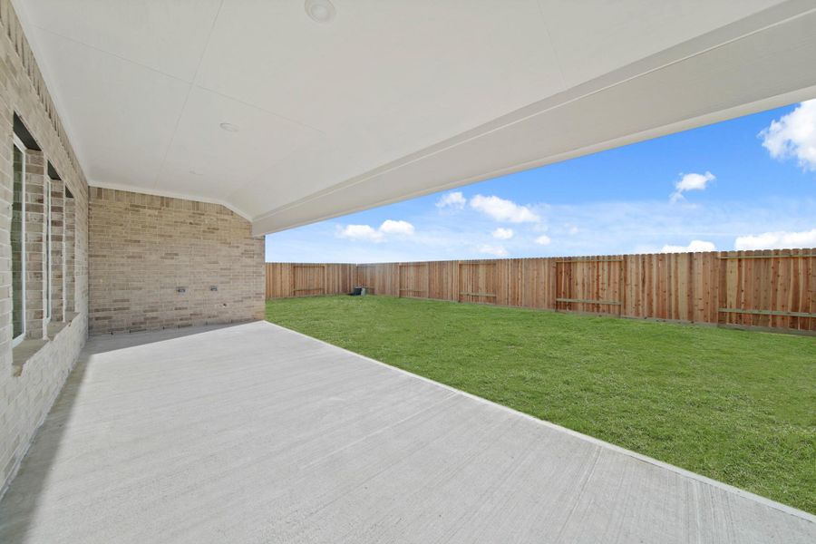 Exterior details and patio area of a home in Riverside Estates, Mont Belvieu (Image 3).