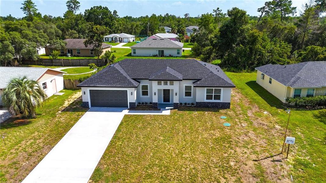 Front exterior of a new home in , Ocala, FL, highlighting curb appeal (Image 25).
