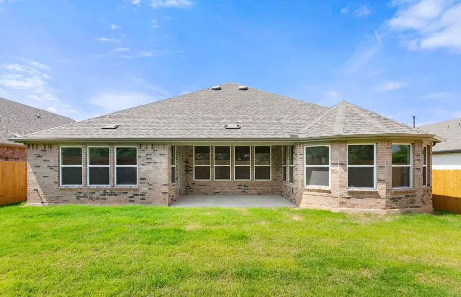 Front exterior of a new home in 6 Creeks, Kyle, TX, highlighting curb appeal (Image 7).
