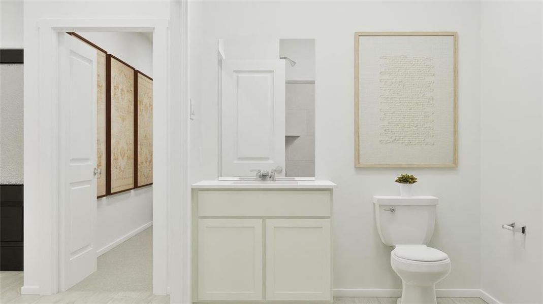 Half bath featuring vanity and baseboards