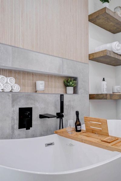 Spa-inspired primary bathroom with freestanding soaking tub and walk-in shower Spa-inspired primary bathroom with freestanding soaking tub and walk-in shower