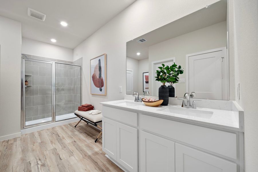 A bathroom with a sink and a shower. A bathroom with a sink and a shower.