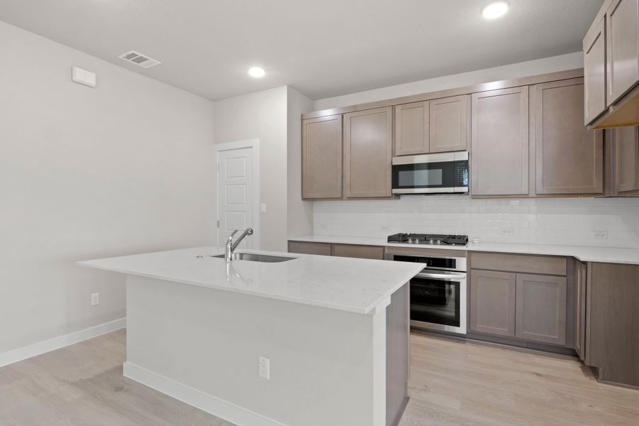 Kitchen in the Willow home plan by Trophy Signature Homes – REPRESENTATIVE PHOTO Kitchen in the Willow home plan by Trophy Signature Homes – REPRESENTATIVE PHOTO