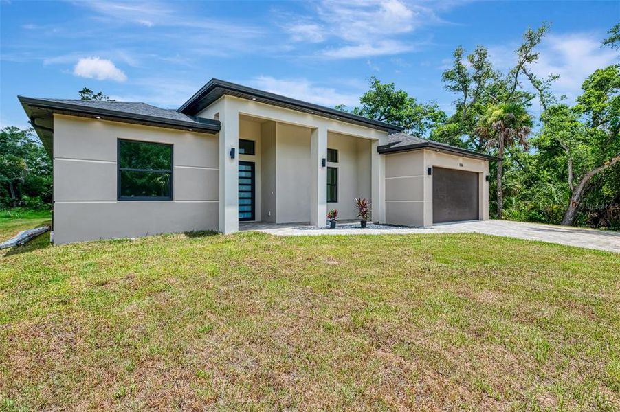 Front exterior of a new home in , Port Charlotte, FL, highlighting curb appeal (Image 25).