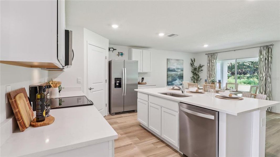 Furnished interior view inside a new home in Triumph South, Wildwood (Image 10).