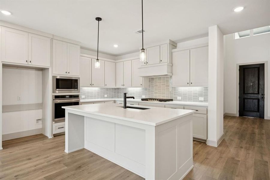 You'll find a dream kitchen featuring outstanding storage and prep space in our beautiful Versailles plan!