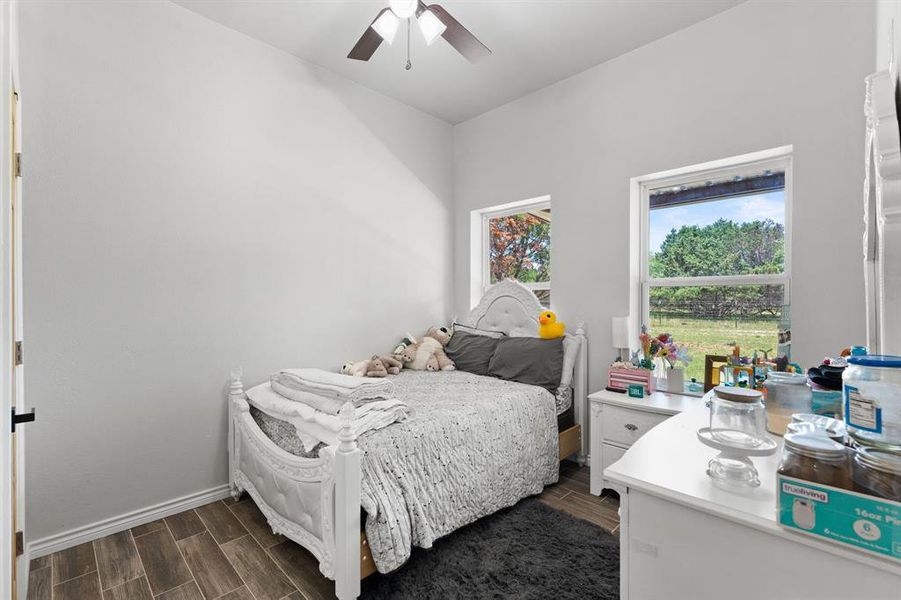 Bedroom #2 with closet, ceiling fan, windows for natural lighting.