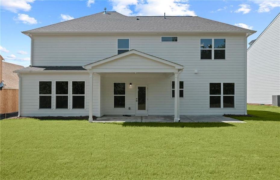 Exterior details and patio area of a home in Creekside at Skelton, Hoschton (Image 3).