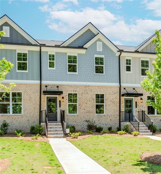 Front exterior of a new home in Hillcrest Landing, Sugar Hill, GA, highlighting curb appeal (Image 26). Front exterior of a new home in Hillcrest Landing, Sugar Hill, GA, highlighting curb appeal (Image 26).