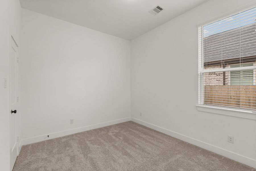 Representative unfurnished interior of a home built from the Rowen by Chesmar Homes in Brookewater 45's, Rosenberg (Image 17).