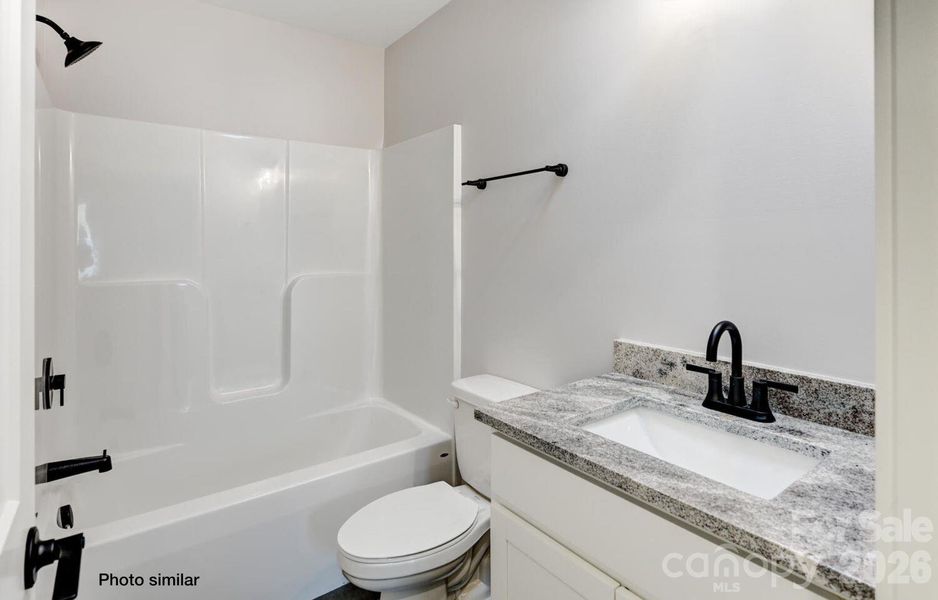 Full bath #2 with tub and tile surround Full bath #2 with tub and tile surround