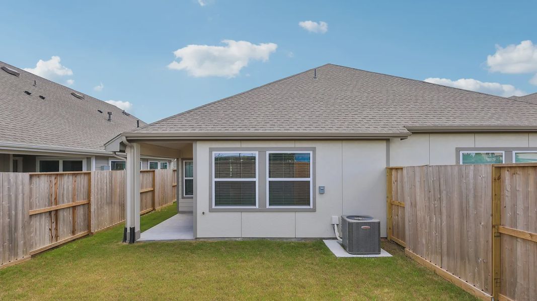 Exterior details and patio area of a home in Meridiana Townhomes, Iowa Colony (Image 18).