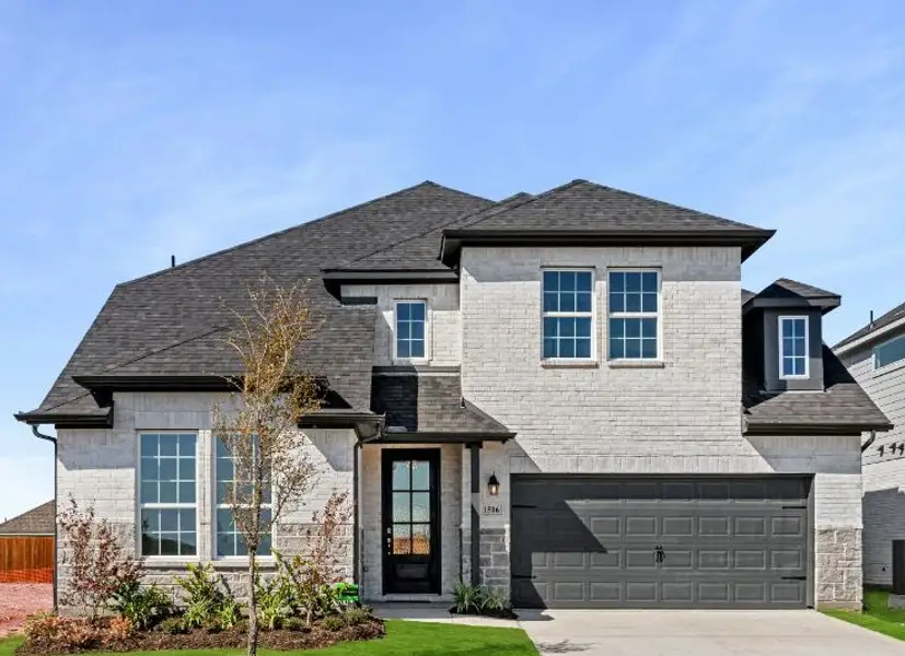 Representative exterior photo of a completed home built from the San Marcos by UnionMain Homes in Lake Breeze, Lavon, TX (Image 2). Representative exterior photo of a completed home built from the San Marcos by UnionMain Homes in Lake Breeze, Lavon, TX (Image 2).
