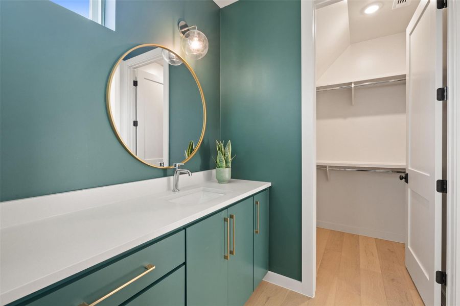 Bathroom with vanity and hardwood / wood-style floors