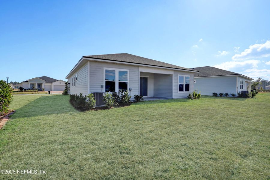 Exterior details and patio area of a home in New 55+ Active Adult Community in Palm Coast, Florida, Palm Coast (Image 14).