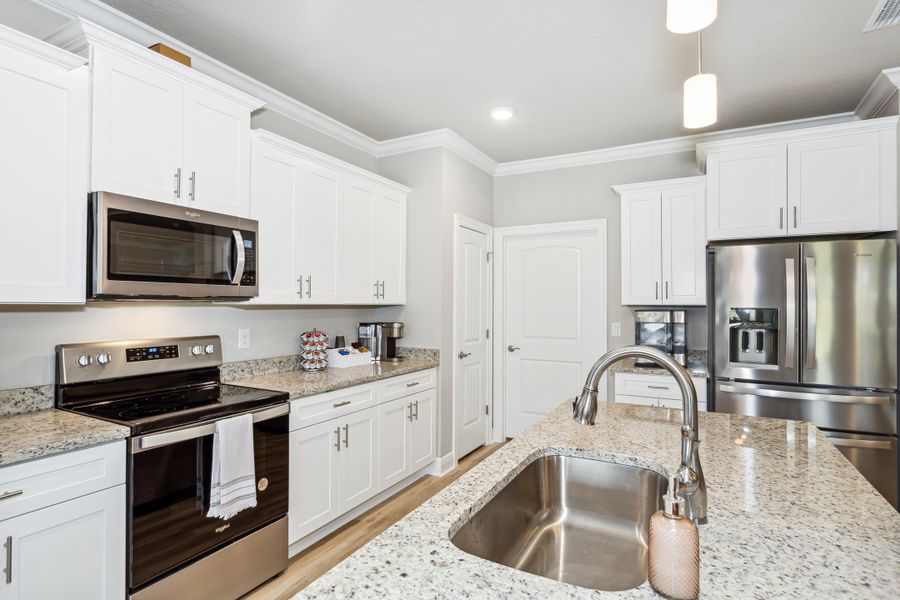 Representative furnished interior of a home built from the The Sapphire by Herbst Homes in Clear Water Landing, Milton (Image 12).