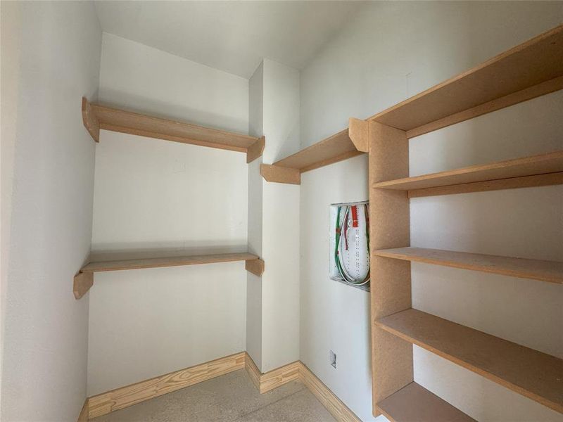 one of two primary walk in closets