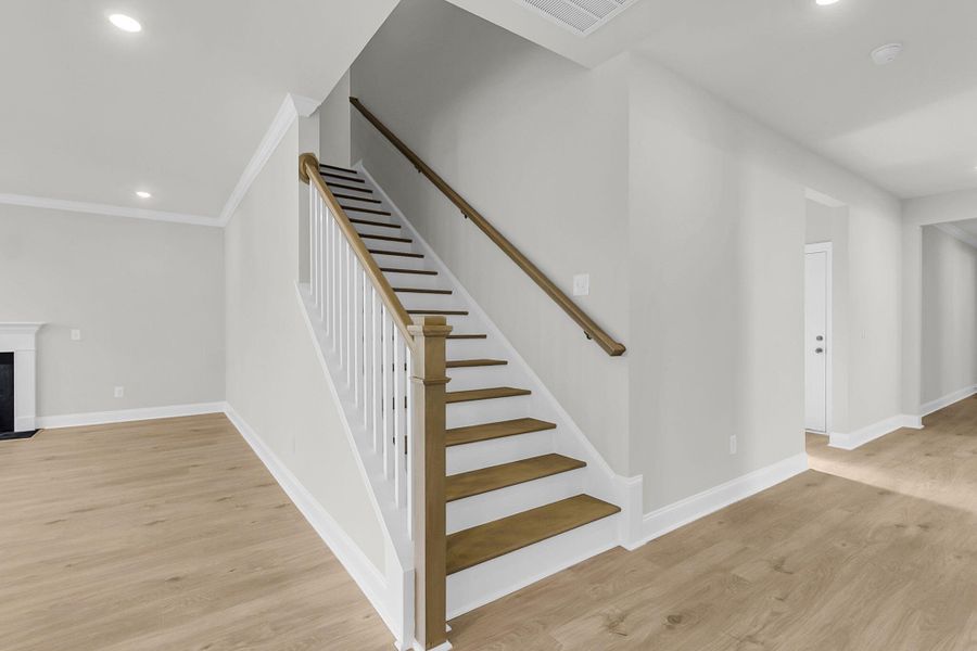 Spacious, unfurnished interior of a new home in Tidewater at Lakes of Cane Bay, Summerville (Image 55).