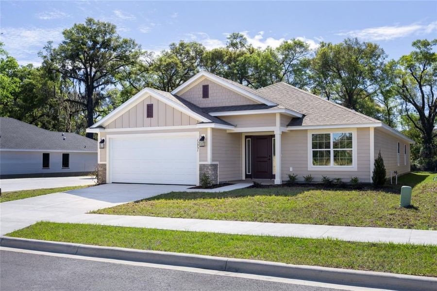 Front exterior of a new home in Kirkland Farms, Alachua, FL, highlighting curb appeal (Image 19). Front exterior of a new home in Kirkland Farms, Alachua, FL, highlighting curb appeal (Image 19).